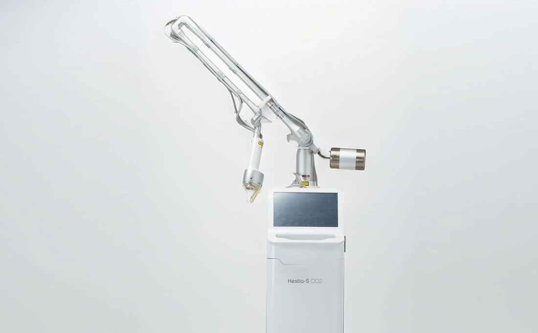 Hestia-S CO₂ Fractional Laser machine in a white studio setting — professional aesthetic system for skin resurfacing and vaginal rejuvenation treatments.