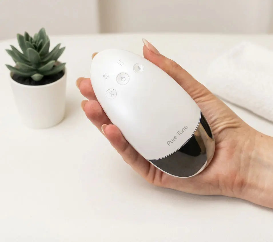Radiance Pod 7 in 1 skincare tool held in hand
