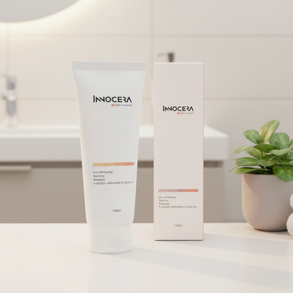 Innocera skincare products on a bathroom counter with a plant and towels in the background.