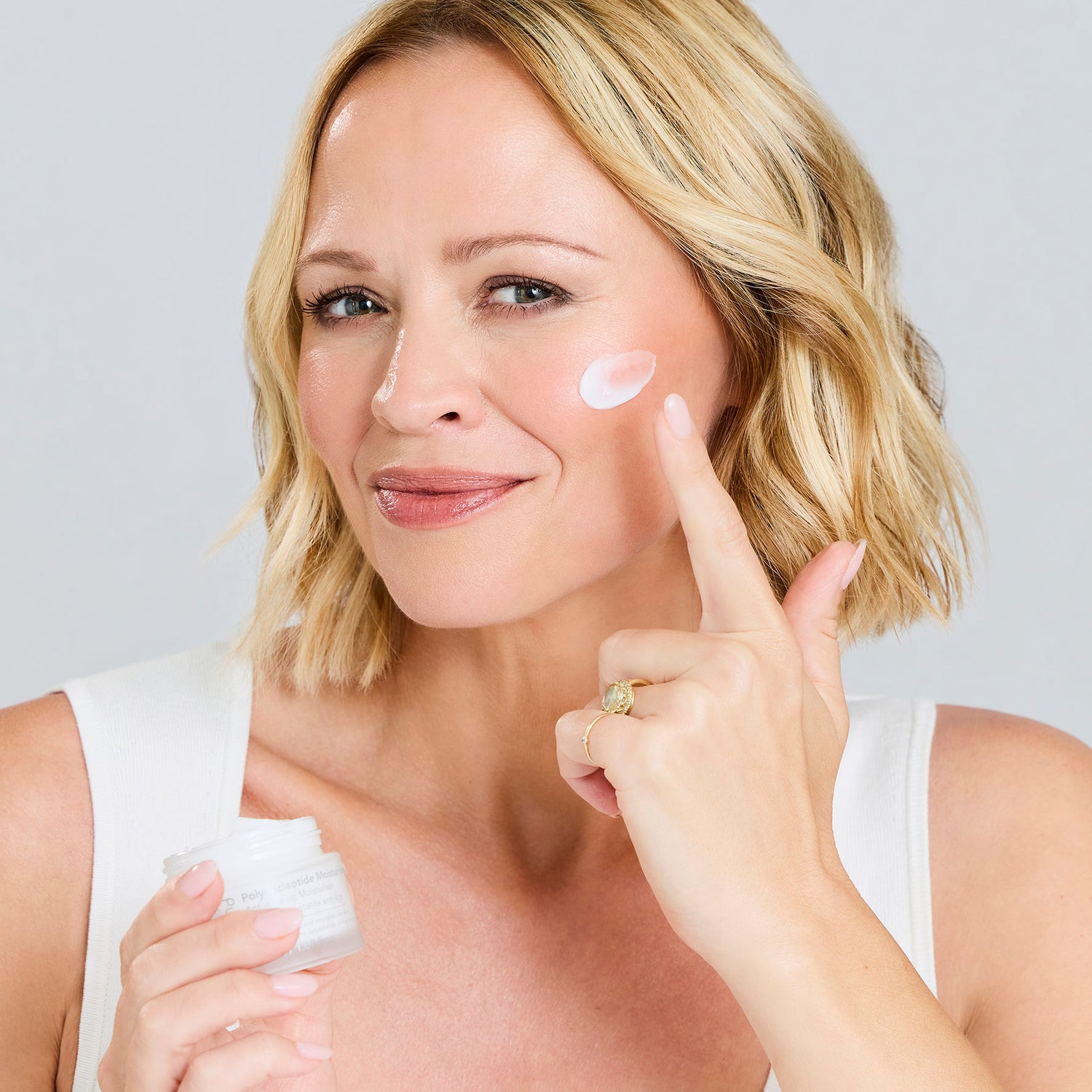 Kimberley Walsh applying Polynucleotide Moisturising Cream as the final step in her skincare routine