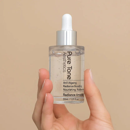 Hand holding a Pure Tone Skincare dropper bottle against a beige background