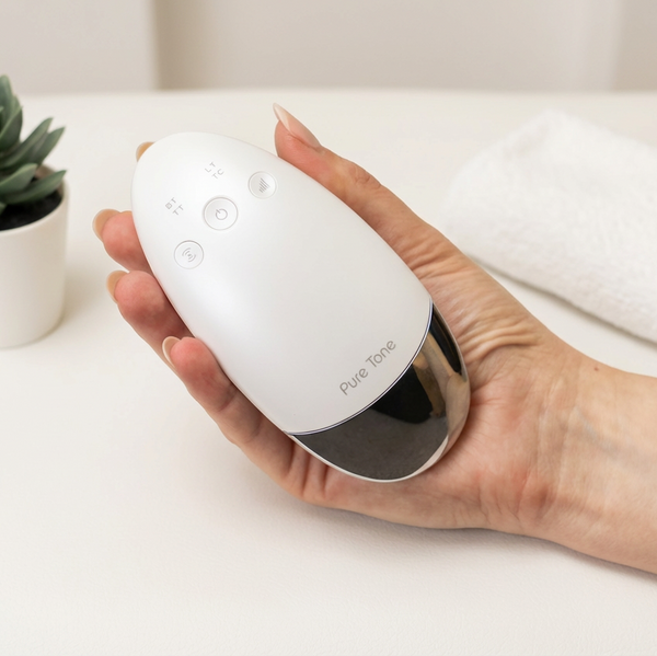 Radiance Pod skincare device being held in hand